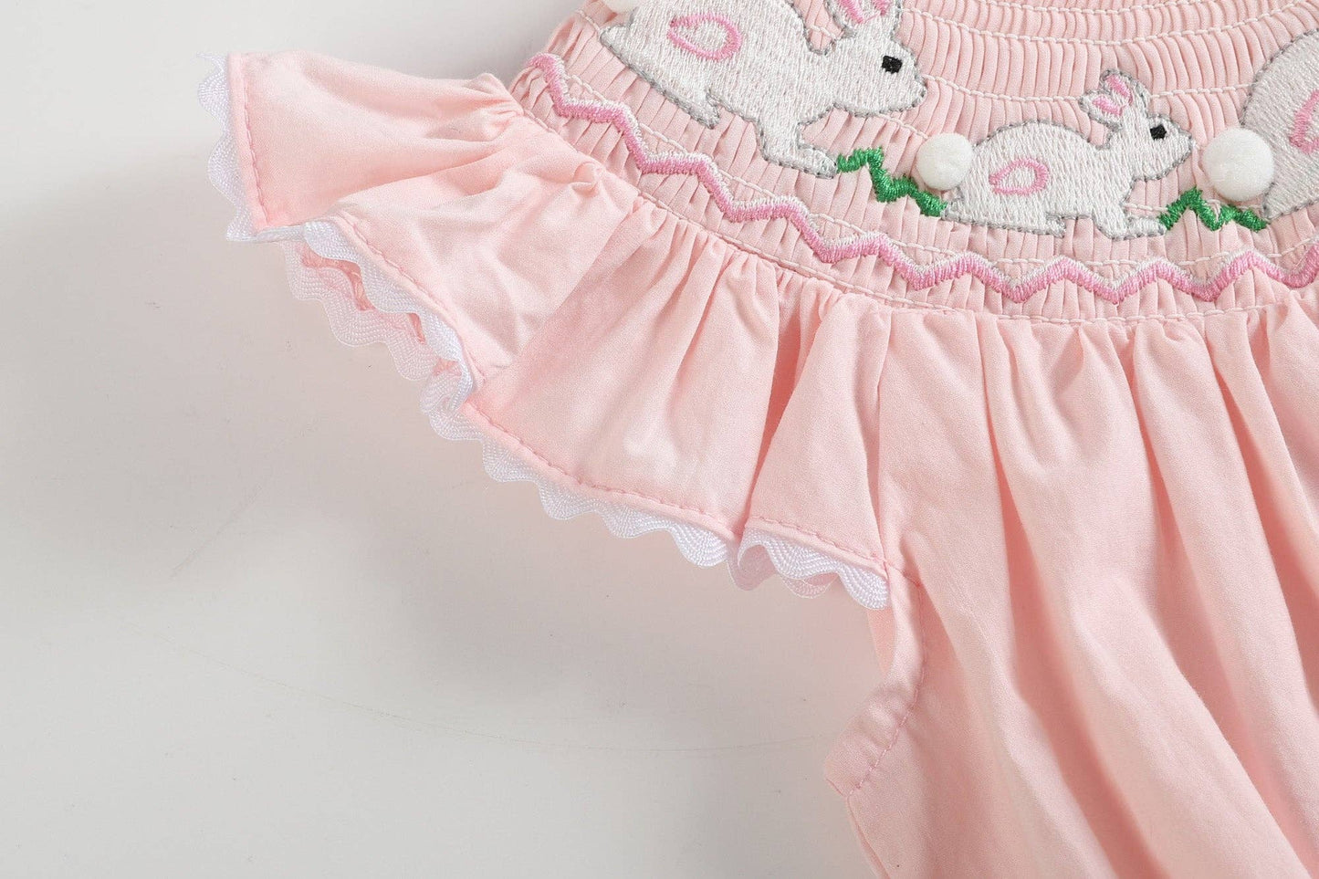 Pink Running Bunnies Smocked Flutter Romper