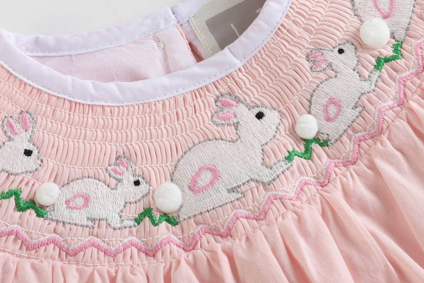 Pink Running Bunnies Smocked Flutter Romper