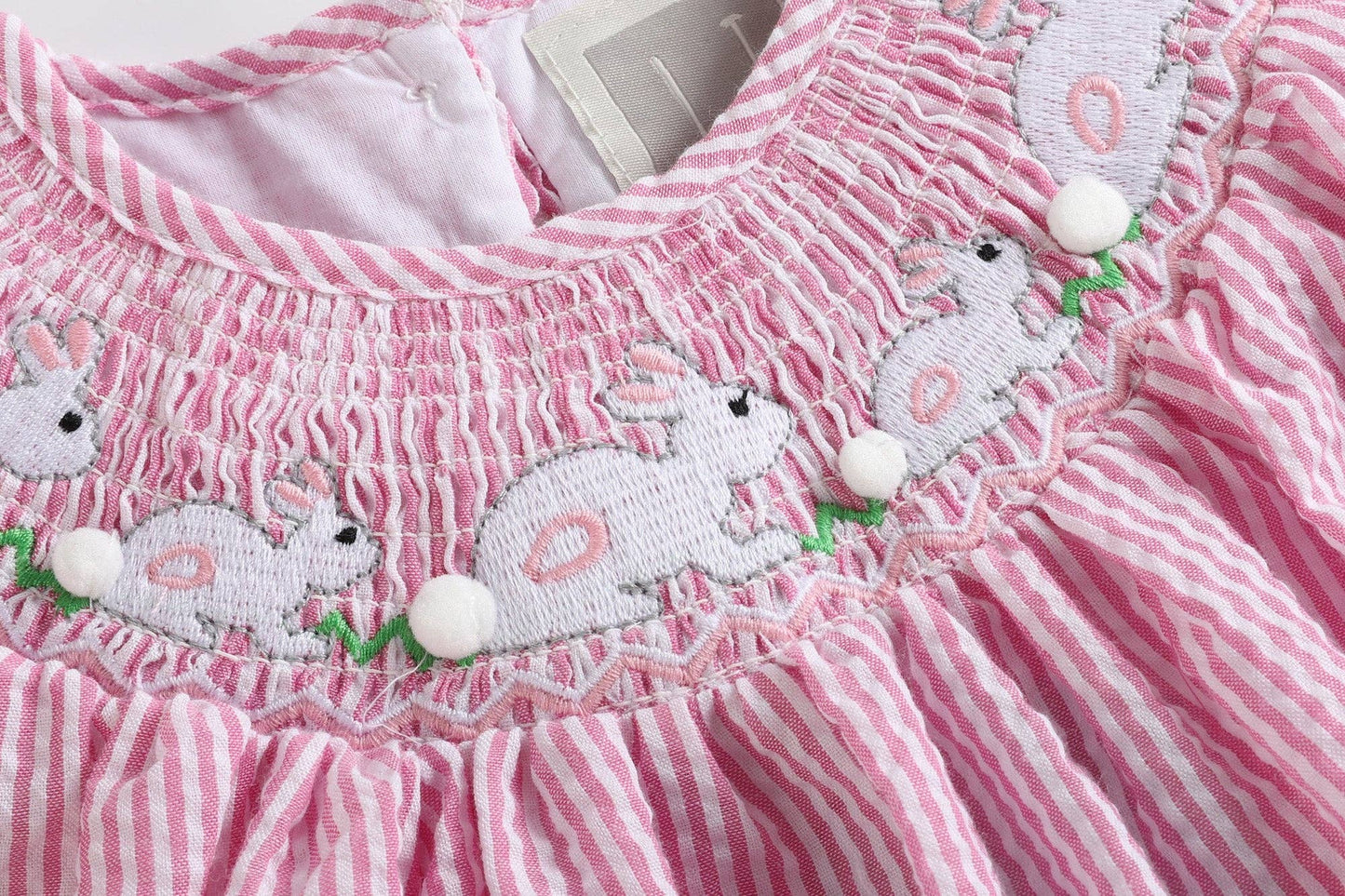 Pink Seersucker Running Bunnies Smocked Bishop Dress